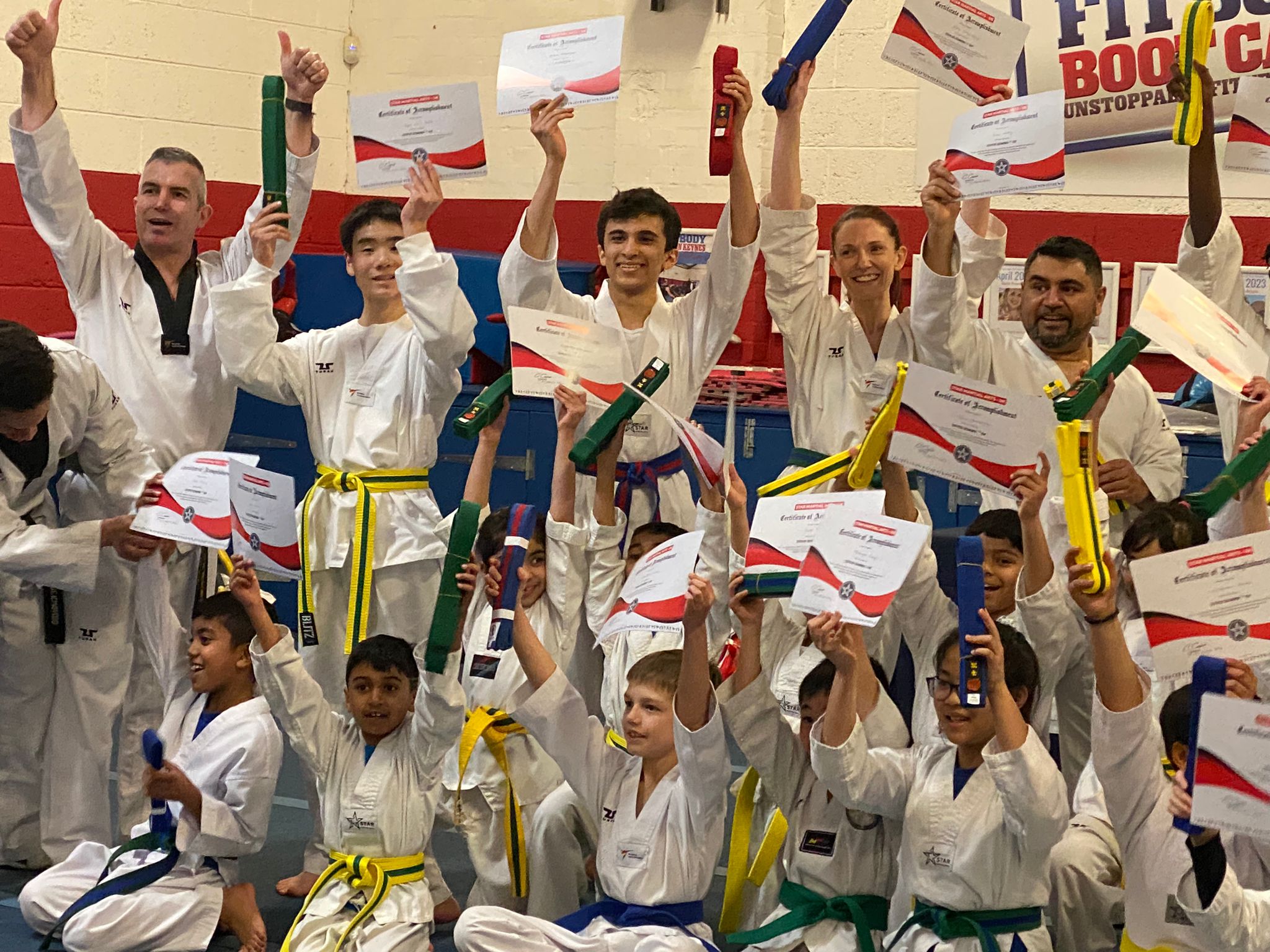 Star Martial Arts students in Milton Keynes displaying their certificates from their Taekwondo grading Mar 24